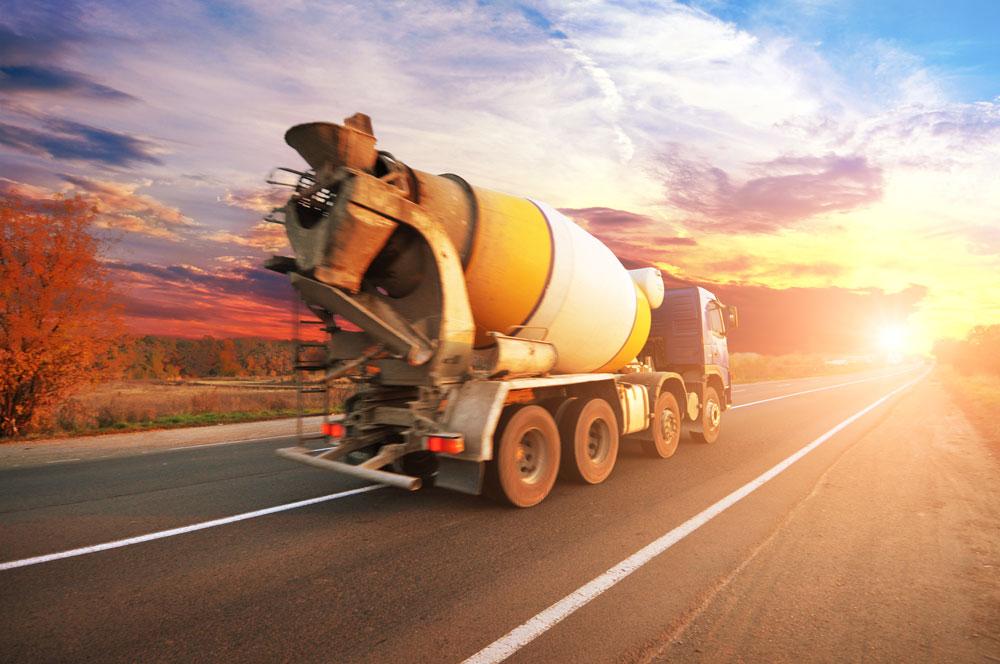 Concrete truck on the road which can be tracked with GoBuild delivery app