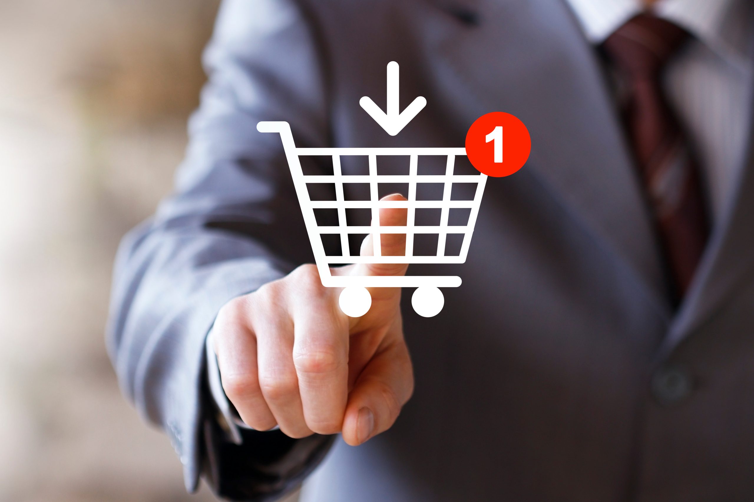 Businessman push web button shopping cart online buy